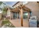 Outdoor patio featuring a pergola, stone accents, and a built-in grill, perfect for outdoor gatherings and relaxation at 10421 W Via Del Sol -- # 379, Peoria, AZ 85383