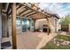 Covered brick patio with pergola, BBQ grill, and sliding glass doors at 10421 W Via Del Sol -- # 379, Peoria, AZ 85383