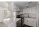 Updated kitchen featuring modern appliances, white cabinets, and ample counter space at 12221 W Bell Rd # 119, Surprise, AZ 85378