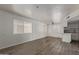 Bright living room featuring new floors, white walls, and natural light at 12221 W Bell Rd # 119, Surprise, AZ 85378