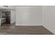 Bright living room featuring new floors with stainless steel kitchen appliances in the background at 12221 W Bell Rd # 119, Surprise, AZ 85378