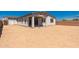 View of the home's backyard with ample space for landscaping or recreational activities at 12361 W Marguerite Ave, Avondale, AZ 85323