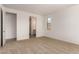 Bedroom featuring neutral carpeting, and white walls, with a bathroom and closet just off to the left at 12361 W Marguerite Ave, Avondale, AZ 85323