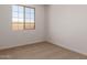 Cozy bedroom with natural light streaming in from a nearby window at 12361 W Marguerite Ave, Avondale, AZ 85323