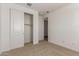 Bright bedroom with open closet doors, offering ample storage space at 12361 W Marguerite Ave, Avondale, AZ 85323