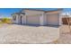 Home exterior with brick driveway and two-car garage at 12361 W Marguerite Ave, Avondale, AZ 85323