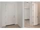 Well-lit home foyer featuring a neutral color palette and tile flooring at 12361 W Marguerite Ave, Avondale, AZ 85323