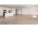 Bright, open-concept living area showcasing the kitchen, tile flooring, and ample space at 12361 W Marguerite Ave, Avondale, AZ 85323