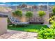 Private backyard area with artificial turf, comfortable seating, and mature landscaping at 14725 N Mariposa Ct, Fountain Hills, AZ 85268