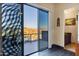 Balcony view through sliding glass door to the surrounding desert mountains and blue skies at 14725 N Mariposa Ct, Fountain Hills, AZ 85268