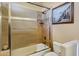 Bathroom featuring a shower-tub combination with tile surround and glass door at 14725 N Mariposa Ct, Fountain Hills, AZ 85268