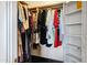 Walk-in closet with custom shelves and hanging rods at 14725 N Mariposa Ct, Fountain Hills, AZ 85268