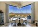 Bright dining room with views, chandelier, and modern furniture at 14725 N Mariposa Ct, Fountain Hills, AZ 85268