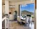 Dining room with elegant lighting, a large view window, and modern decor at 14725 N Mariposa Ct, Fountain Hills, AZ 85268