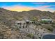 Beautiful desert home with drive leading to three car garage and landscaped hillside at 14725 N Mariposa Ct, Fountain Hills, AZ 85268