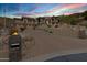 Impressive home exterior with modern architecture, desert landscaping, a multi-car garage, and private driveway at 14725 N Mariposa Ct, Fountain Hills, AZ 85268