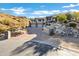 Beautiful view of the home with desert landscaping and long driveway on a circular drive at 14725 N Mariposa Ct, Fountain Hills, AZ 85268