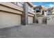 Exterior view of a home with a paved driveway and a three-car garage at 14725 N Mariposa Ct, Fountain Hills, AZ 85268