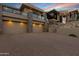 Beautiful home featuring a three-car garage, desert landscaping, and a brick paved driveway at 14725 N Mariposa Ct, Fountain Hills, AZ 85268