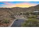 Stunning exterior of desert home with circular driveway, mature landscaping and mountain views at 14725 N Mariposa Ct, Fountain Hills, AZ 85268