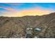 Wide aerial showcasing multiple luxury homes nestled hillside in mature desert landscaping at 14725 N Mariposa Ct, Fountain Hills, AZ 85268