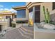 Exterior view of the home's front entrance with desert landscaping and a brick-paved staircase at 14725 N Mariposa Ct, Fountain Hills, AZ 85268