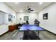 Spacious game room featuring a table tennis setup, desk, and workout equipment at 14725 N Mariposa Ct, Fountain Hills, AZ 85268