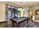Game room with a pool table, hardwood floors, and access to an outdoor patio at 14725 N Mariposa Ct, Fountain Hills, AZ 85268