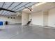 Large 4+ car garage featuring epoxy floors, ample space, and stair access at 14725 N Mariposa Ct, Fountain Hills, AZ 85268