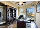 This home office features a large built-in bookcase, a desk with a view, and plenty of natural light at 14725 N Mariposa Ct, Fountain Hills, AZ 85268