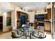 Gourmet kitchen boasts high-end appliances, custom cabinetry, and a glass dining table at 14725 N Mariposa Ct, Fountain Hills, AZ 85268