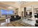 Open-concept living room with views, elegant furniture, and seamless flow to dining area at 14725 N Mariposa Ct, Fountain Hills, AZ 85268