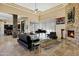 Spacious living room with high ceilings, a fireplace, a piano, and lots of natural light at 14725 N Mariposa Ct, Fountain Hills, AZ 85268