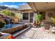 Beautiful patio with a waterfall feature and comfortable seating area at 14725 N Mariposa Ct, Fountain Hills, AZ 85268