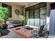 Outdoor patio with comfortable seating, mature trees, and stylish decor at 14725 N Mariposa Ct, Fountain Hills, AZ 85268