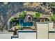 Aerial view of a sparkling pool with rock waterfall feature and desert landscaping at 14725 N Mariposa Ct, Fountain Hills, AZ 85268