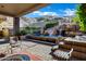 Lush backyard oasis featuring a pool with a waterfall, water slide, and beautiful desert views at 14725 N Mariposa Ct, Fountain Hills, AZ 85268