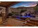 Luxury backyard with a custom pool with waterfall, slide, lush landscaping, and beautiful mountain views at 14725 N Mariposa Ct, Fountain Hills, AZ 85268