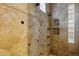 A primary bathroom featuring an intricately tiled shower with dual shower heads and inset shelving at 14725 N Mariposa Ct, Fountain Hills, AZ 85268