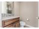 Well-lit half-bathroom with stylish vanity and elegant fixtures at 1474 E Elysian Pass, Queen Creek, AZ 85140