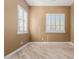 Bright bedroom with shuttered windows, baseboards, and a neutral color palette, creating a calm and inviting atmosphere at 1474 E Elysian Pass, Queen Creek, AZ 85140