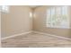 Inviting bedroom with tile flooring and shuttered windows offers a blend of style and functionality for a comfortable living space at 1474 E Elysian Pass, Queen Creek, AZ 85140