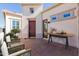 Inviting front entrance with a stylish patio and cozy seating area at 1474 E Elysian Pass, Queen Creek, AZ 85140