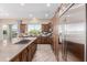 Modern kitchen featuring stainless steel appliances, a center island, and ample counter space at 1474 E Elysian Pass, Queen Creek, AZ 85140
