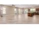Open-concept living space features tile floors, generous natural light, and seamless transitions to the kitchen and outdoor areas at 1474 E Elysian Pass, Queen Creek, AZ 85140