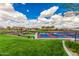 Community pickleball courts are ready for a match with expansive views and grassy surroundings at 1474 E Elysian Pass, Queen Creek, AZ 85140