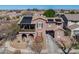 Beautiful home with solar panels and a charming balcony overlooking the landscaped front yard at 15260 W Alexandria Way, Surprise, AZ 85379