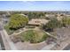 Aerial view of the Heritage Club featuring well-maintained landscaping and an expansive lawn at 15260 W Alexandria Way, Surprise, AZ 85379