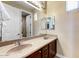 Bathroom featuring double sinks and a large mirror at 15260 W Alexandria Way, Surprise, AZ 85379