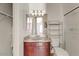 Bathroom featuring a single sink with a mirror and shower at 15260 W Alexandria Way, Surprise, AZ 85379